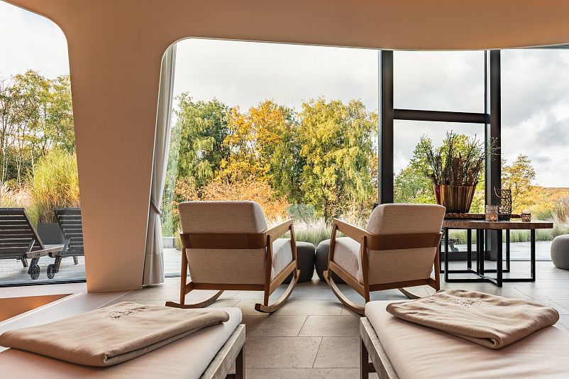 Spa relaxation room with autumn forest view